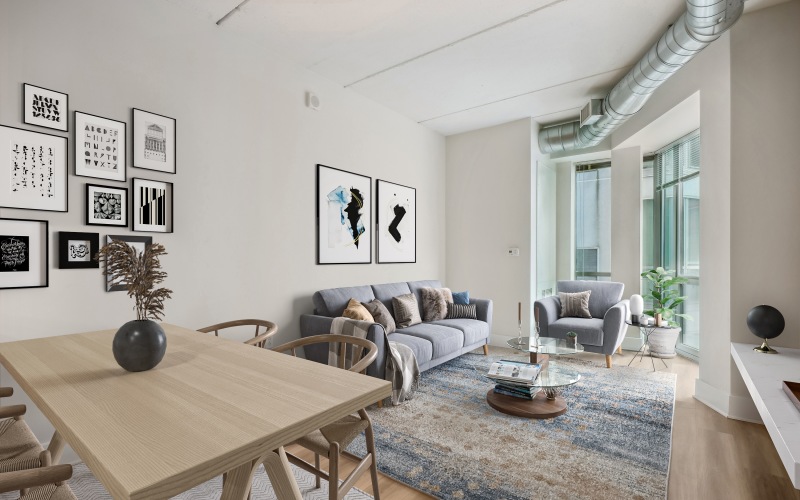 a living room with a couch and tables